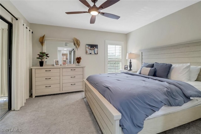 carpeted bedroom with ceiling fan