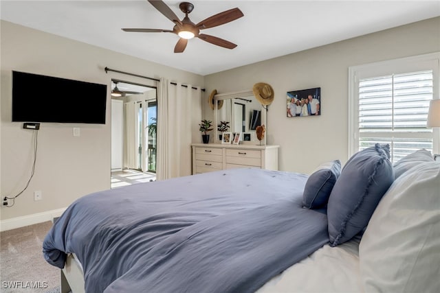 carpeted bedroom featuring access to exterior and ceiling fan