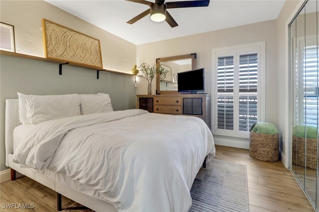 bedroom with hardwood / wood-style floors and ceiling fan