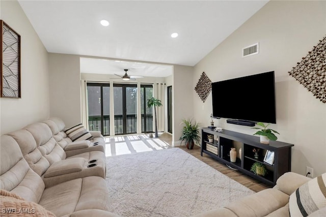 living room featuring ceiling fan and light wood-type flooring