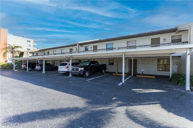 view of car parking featuring a carport