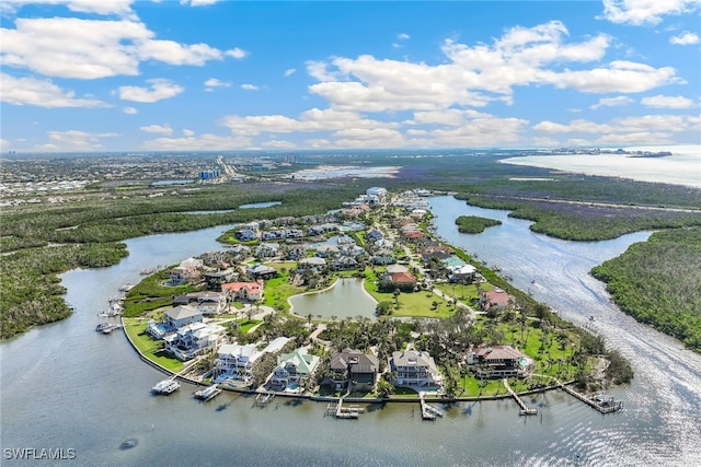 birds eye view of property featuring a water view and a residential view