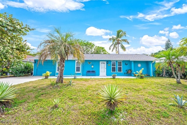 ranch-style house with an attached garage, concrete driveway, a front yard, and stucco siding