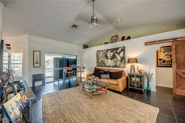 tiled living room with ceiling fan and vaulted ceiling