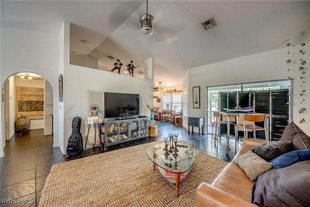 tiled living room featuring high vaulted ceiling and ceiling fan