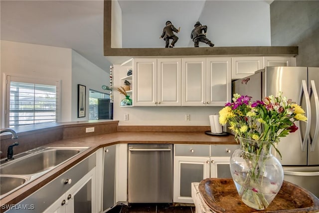 kitchen featuring white cabinetry, sink, and stainless steel appliances