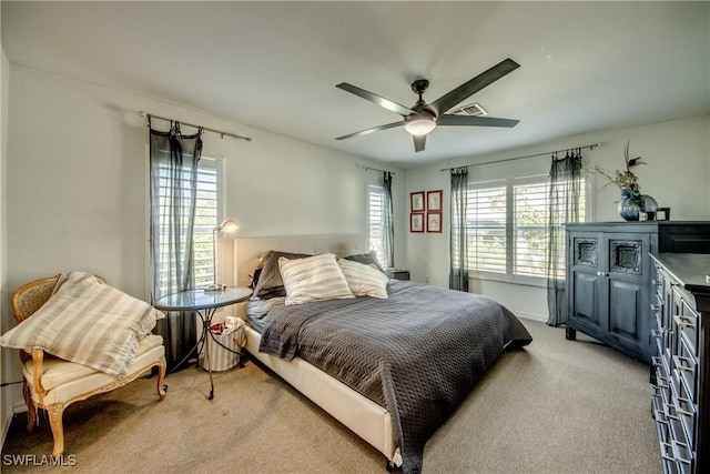 carpeted bedroom featuring ceiling fan