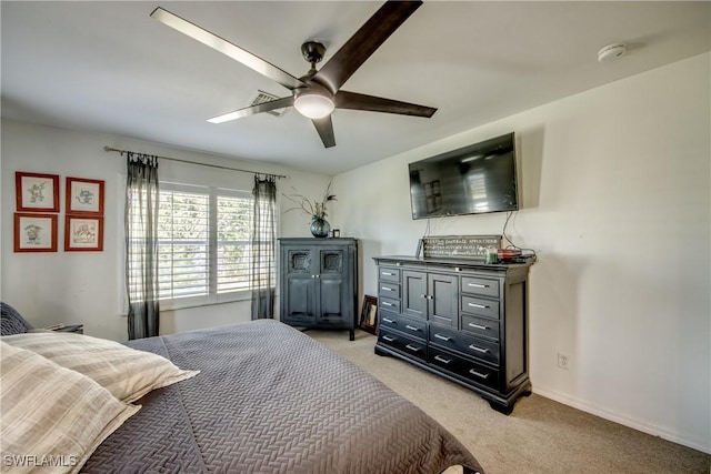 bedroom featuring ceiling fan and light carpet