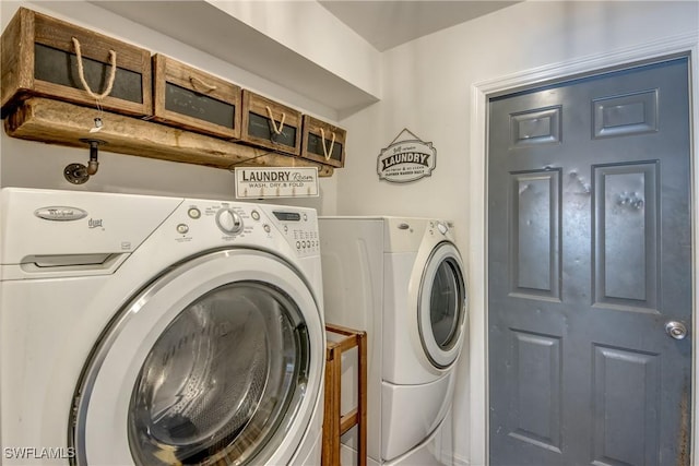 washroom with washing machine and clothes dryer