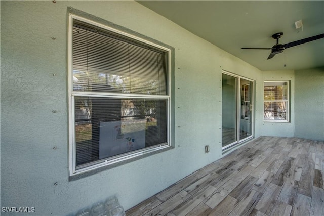 wooden terrace with ceiling fan