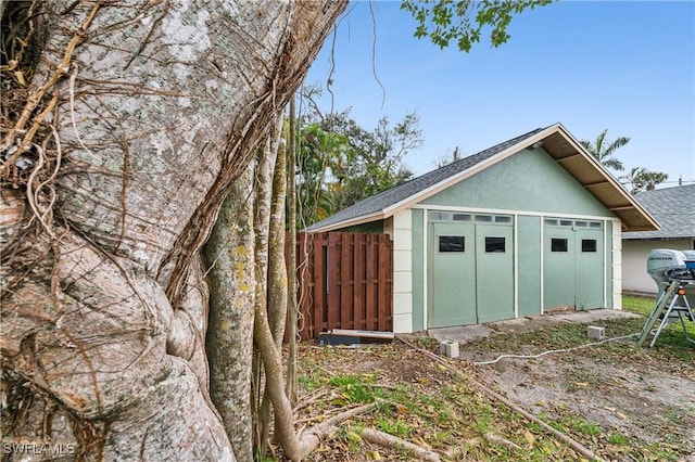 garage featuring fence