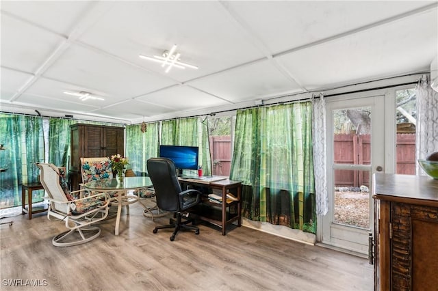 office space with a sunroom and wood finished floors