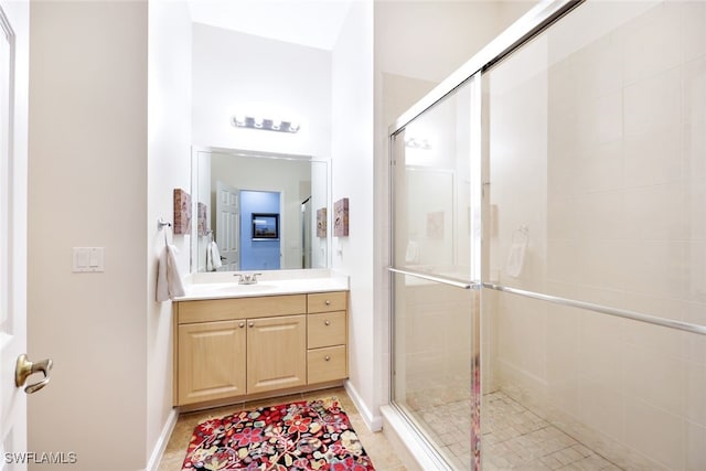 bathroom with vanity and an enclosed shower