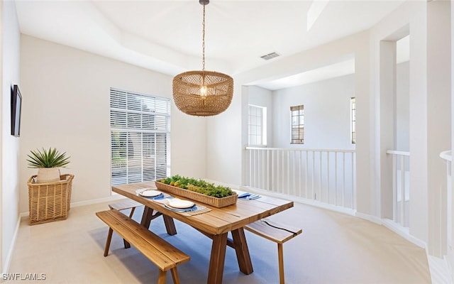 dining space with light colored carpet