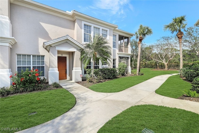 view of front of house with a front lawn