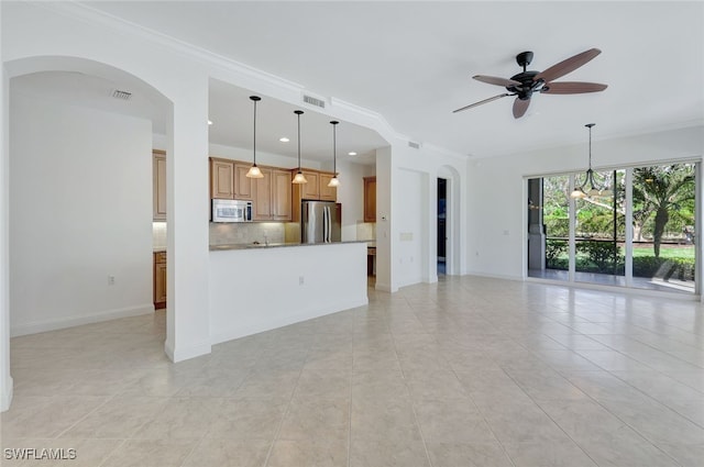 unfurnished living room with crown molding, light tile patterned flooring, and ceiling fan with notable chandelier