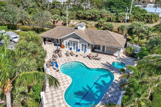 view of pool featuring french doors and a patio