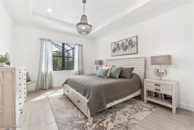 bedroom with a raised ceiling