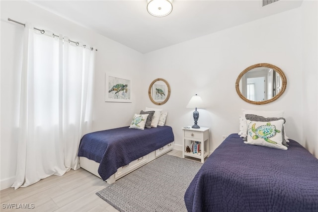 bedroom with light hardwood / wood-style floors