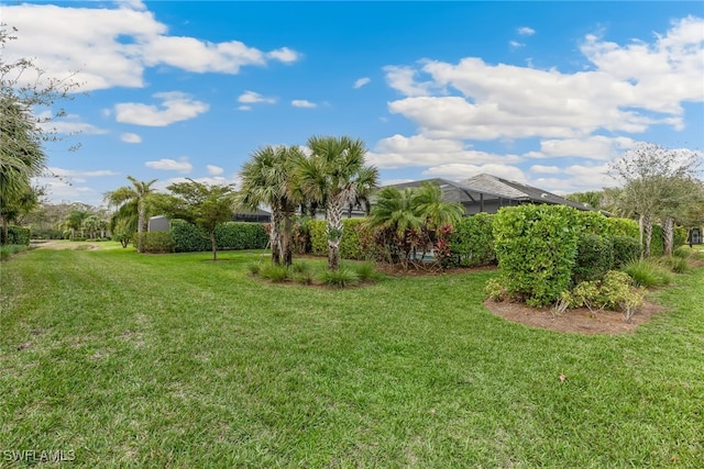 view of yard with a lanai