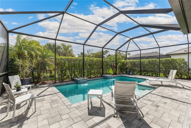 view of pool featuring pool water feature, a lanai, and a patio area