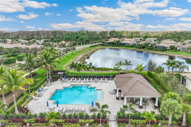 view of swimming pool featuring a gazebo, a water view, and a patio area