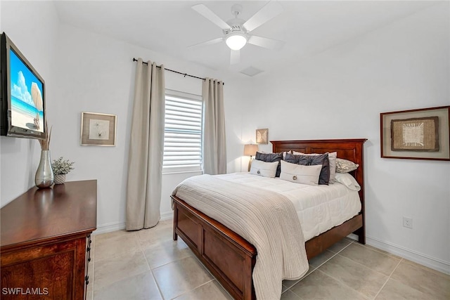 6231 Brunello Ln, Naples, FL 34113 - bedroom with light tile patterned floors, a ceiling fan, and baseboards