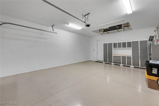 6231 Brunello Ln, Naples, FL 34113 - garage featuring a garage door opener