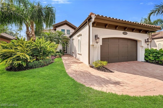 6231 Brunello Ln, Naples, FL 34113 - view of side of property featuring a garage, decorative driveway, a lawn, and stucco siding