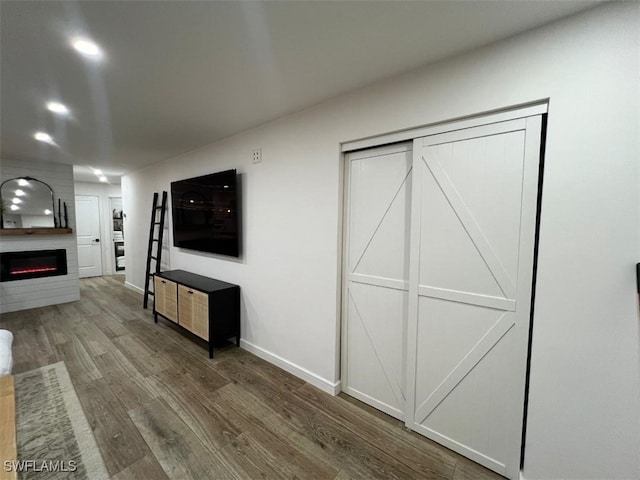 living room with a fireplace and dark hardwood / wood-style floors