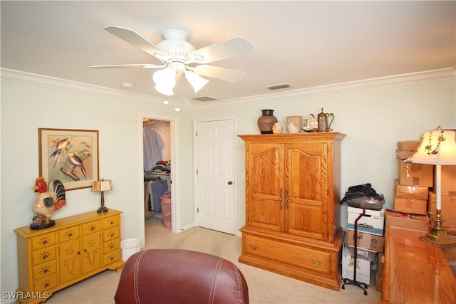 interior space with crown molding, light carpet, and ceiling fan