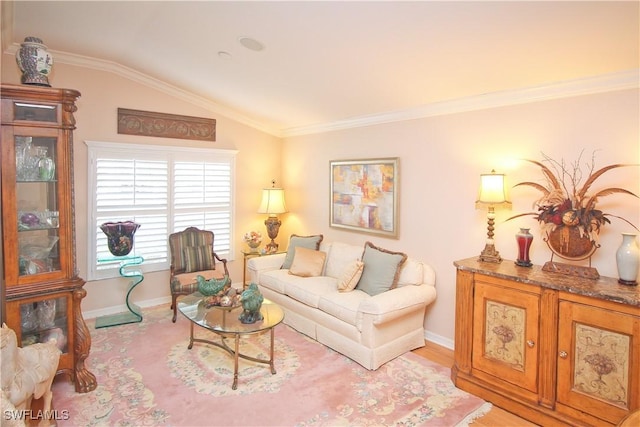 living room featuring ornamental molding, lofted ceiling, and light hardwood / wood-style floors