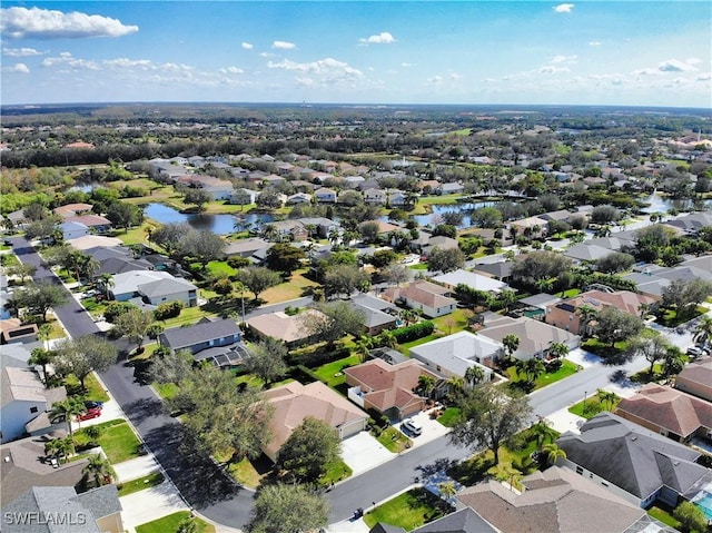 bird's eye view with a water view