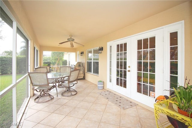 sunroom with ceiling fan and french doors