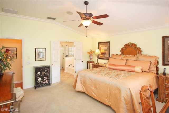 bedroom with lofted ceiling, crown molding, ceiling fan, ensuite bathroom, and light carpet