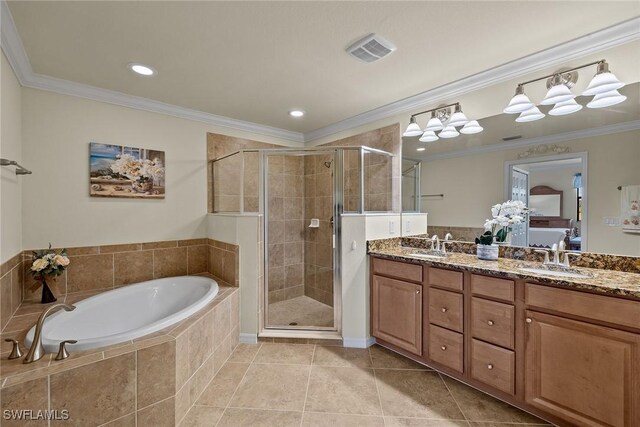 bathroom with ornamental molding, a sink, and a shower stall