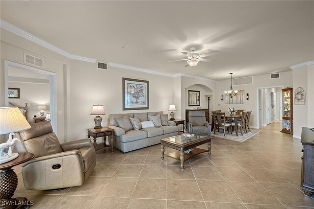 living area featuring light tile patterned floors, visible vents, and ornamental molding