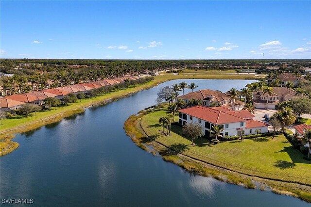 drone / aerial view with a water view and a residential view