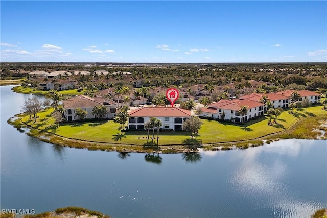 drone / aerial view with a water view and a residential view