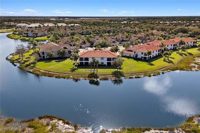 drone / aerial view featuring a water view and a residential view