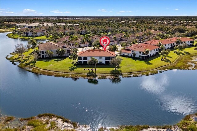 birds eye view of property featuring a residential view and a water view