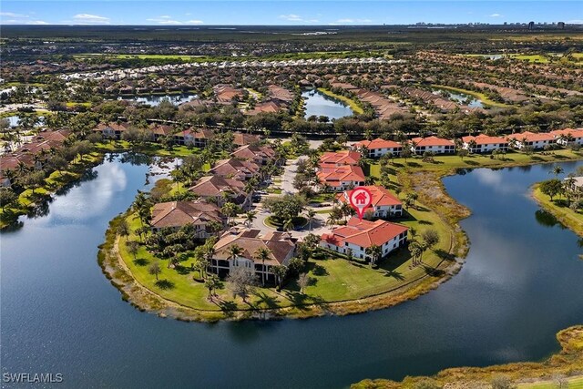 birds eye view of property featuring a water view and a residential view