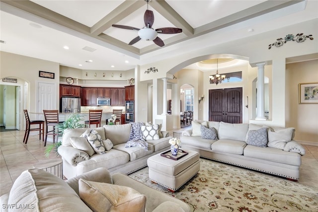 tiled living room featuring coffered ceiling, ornate columns, and beam ceiling