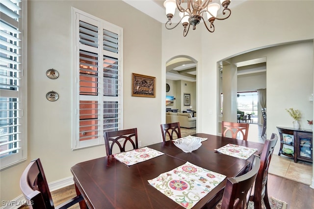 dining space with an inviting chandelier and wood-type flooring