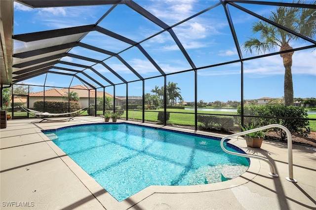 view of pool featuring a patio area and glass enclosure