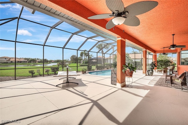 view of patio with a lanai and ceiling fan