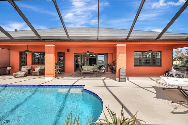 view of pool featuring ceiling fan, a lanai, a patio, and outdoor lounge area