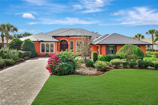 view of front of property with a front lawn