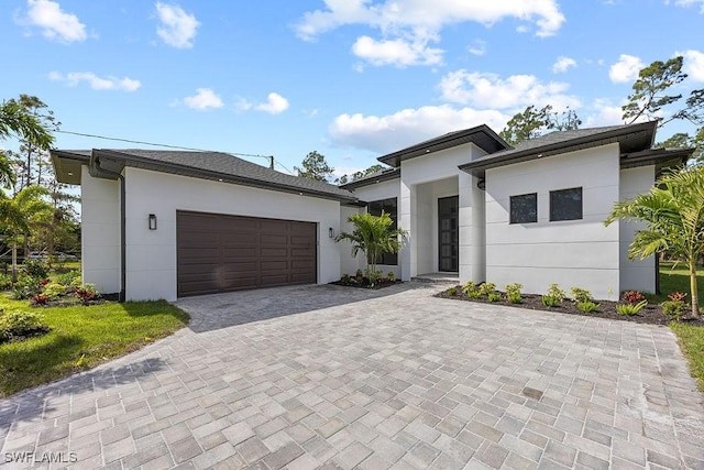 view of front of home with a garage