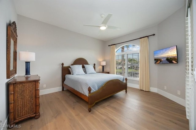 bedroom featuring ceiling fan and light hardwood / wood-style flooring